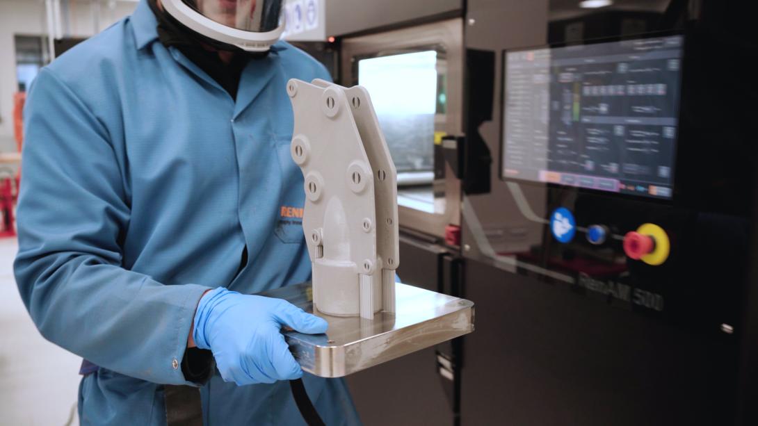 A renishaw engineer carries a 3D-printed titanium part of the INEO Brittania yacht